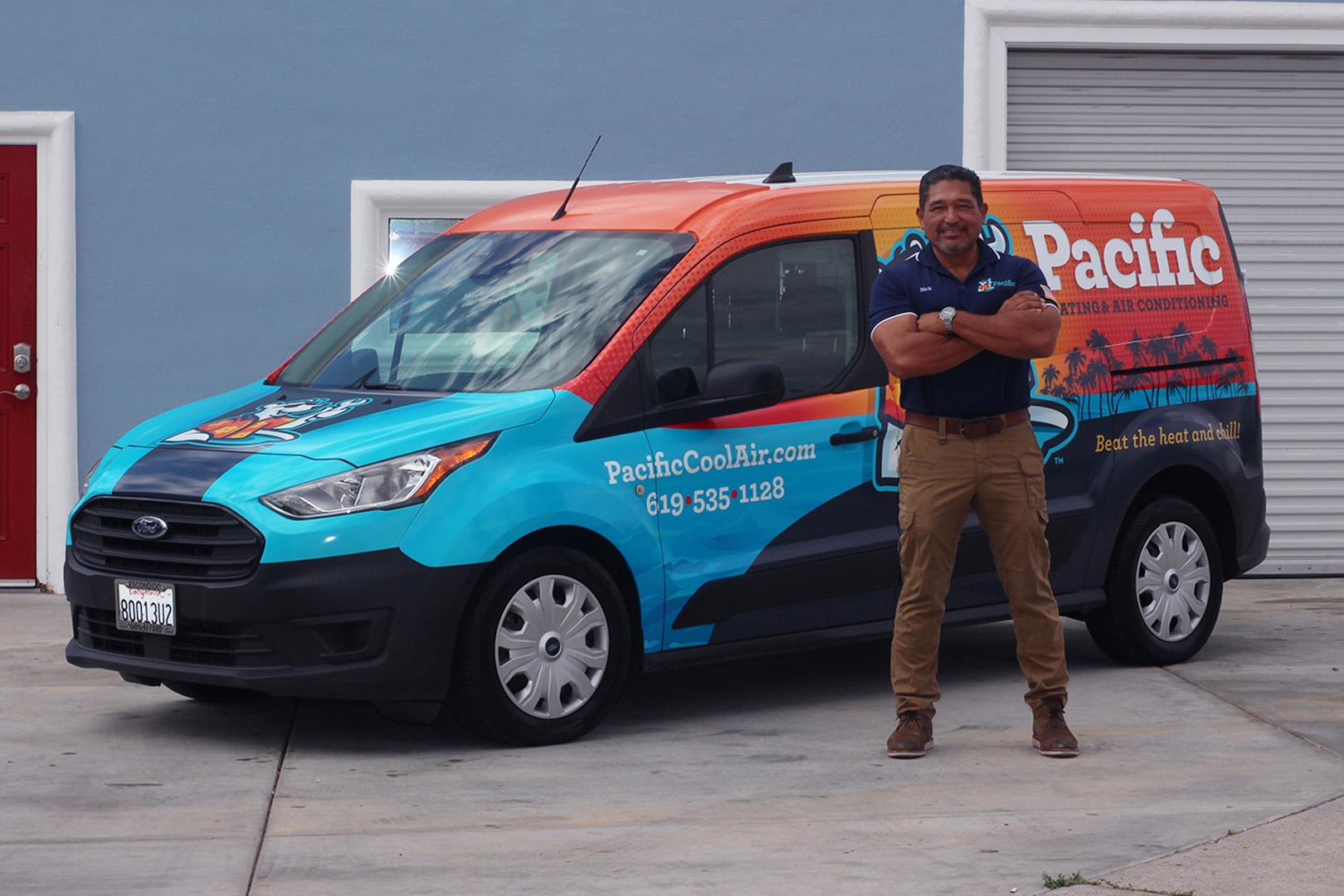 Pacific Heating and Air Conditioning service van with company branding, parked outside a home, alongside a smiling HVAC technician in uniform. Company website and phone number displayed on van.